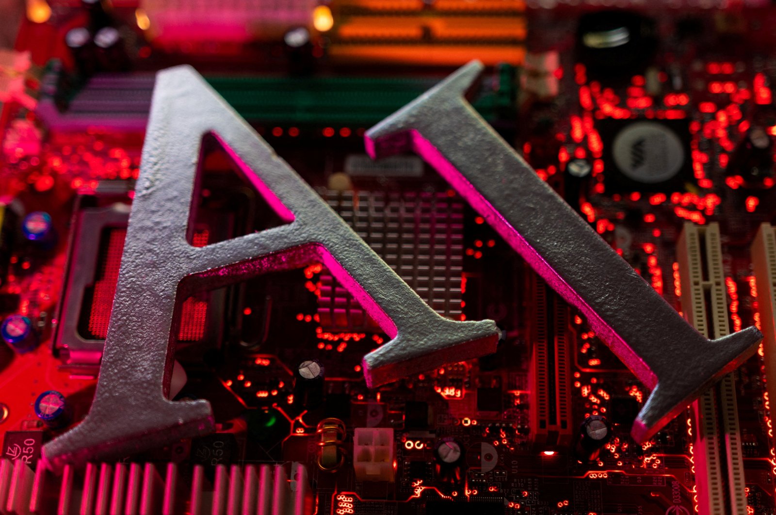Artificial Intelligence letters on computer motherboard in an illustration dated June 23, 2023. (Reuters Photo)