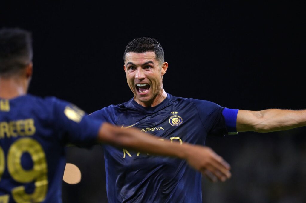 Al-Nassr's Cristiano Ronaldo (R) celebrates after scoring a goal during the Saudi Pro League football match against Al-Hazm at the King Abdullah Sports City, Buraidah, Saudi Arabia, Sept. 2, 2023. (AFP Photo)