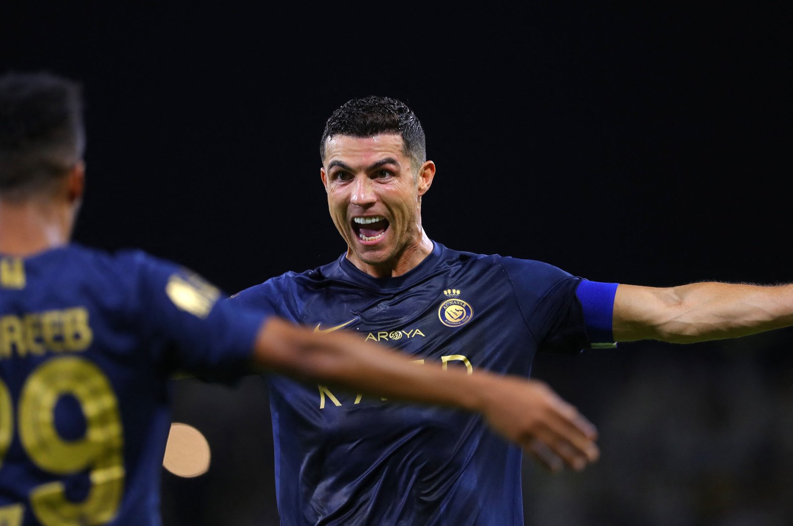 Al-Nassr's Cristiano Ronaldo (R) celebrates after scoring a goal during the Saudi Pro League football match against Al-Hazm at the King Abdullah Sports City, Buraidah, Saudi Arabia, Sept. 2, 2023. (AFP Photo)