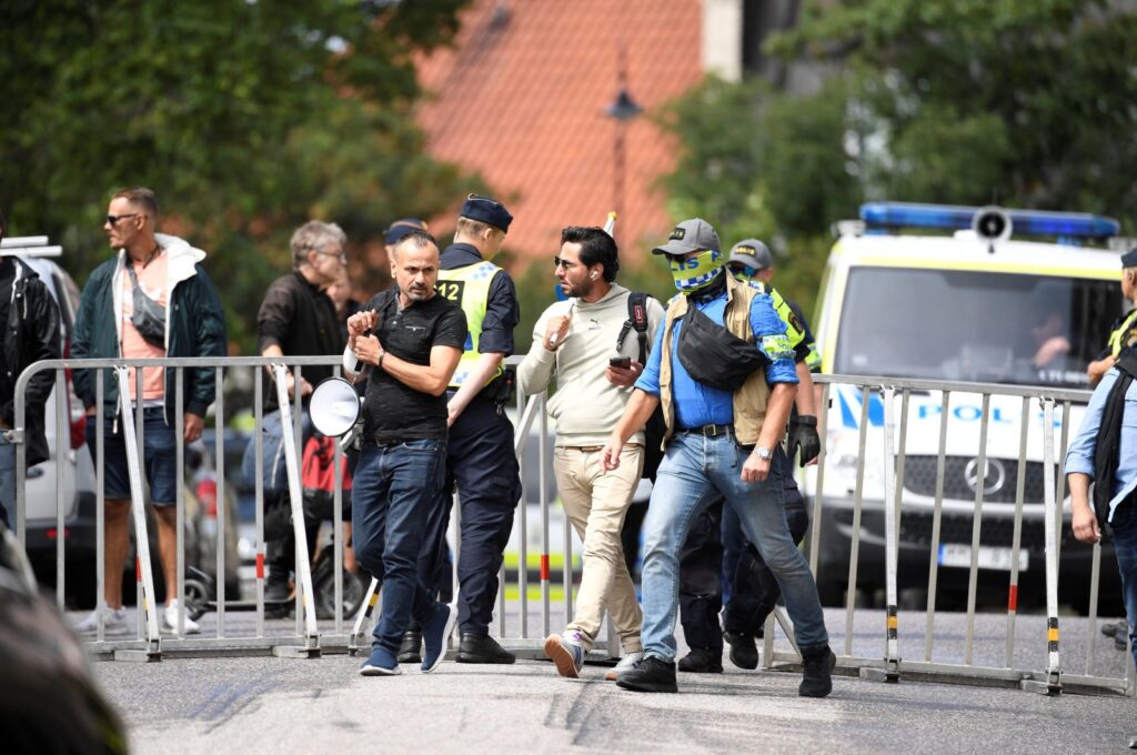 Protestor Salwan Momika is escorted by police to a location in Stockholm, Sweden, July 20, 2023. (Reuters Photo)