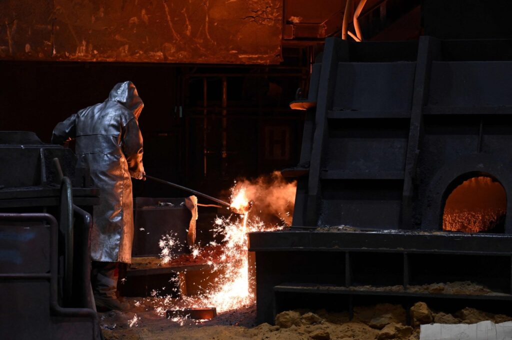 A steelworker is seen at the blast furnace at the steel works of industrial giant ThyssenKrupp Steel Europe AG in Duisburg, western Germany, July 26, 2023. (AFP Photo)