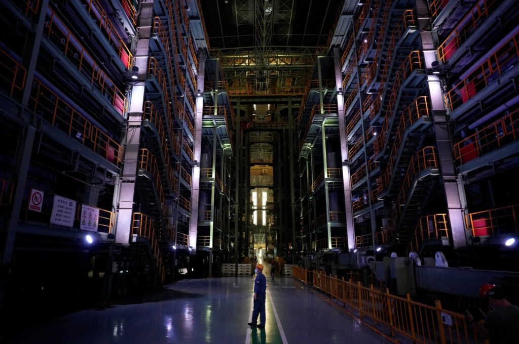 An employee stands at a cold rolling plant during a government-organized media tour to Baoshan Iron & Steel Co., Ltd. (Baosteel), a subsidiary of China Baowu Steel Group, Shanghai, China, Sept. 16, 2022. (Reuters Photo)