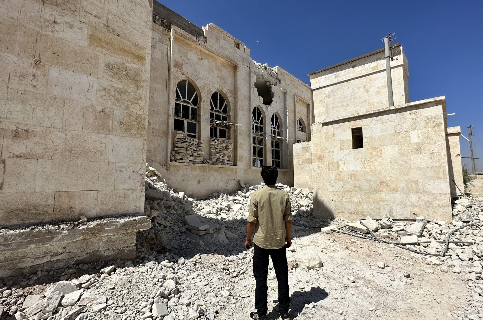 A man observes the damage to the mosque in the village, in al-Bab, Syria, Sept. 7, 2023. (AA Photo)