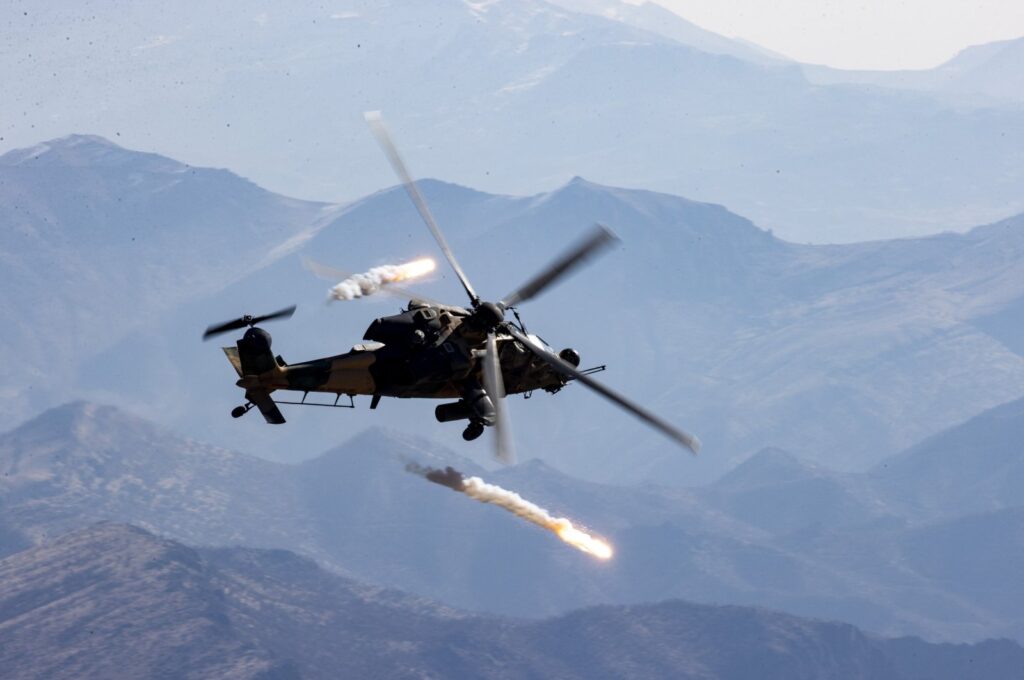 A helicopter fires a missile during the operation near the border, in Hakkari, southeastern Türkiye, Jan. 14, 2023. (AA Photo)