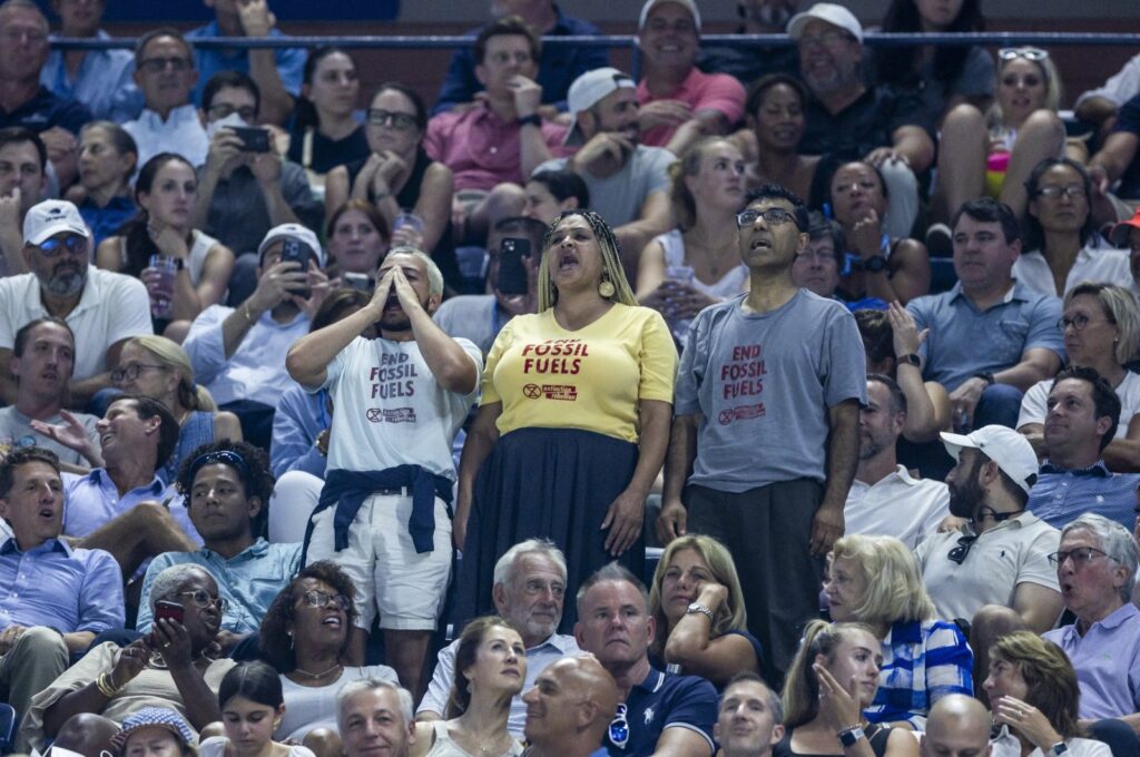 Climate protesters delay the semifinal match between USA's Coco Gauff and Czechia's Karolina Muchova at the US Open Tennis Championships at the USTA National Tennis Center in Flushing Meadows, New York, US., Sept. 7, 2023. (EPA Photo)