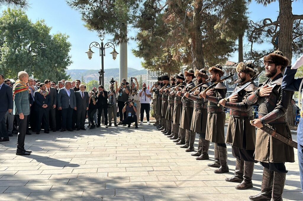 Parliament Speaker Numan Kurtulmuş is photographed in front of soldiers dressed as Ertuğrul's "alps'' during the ceremony in Bilecik, southwestern Türkiye, Sept. 10, 2023. (DHA Photo)