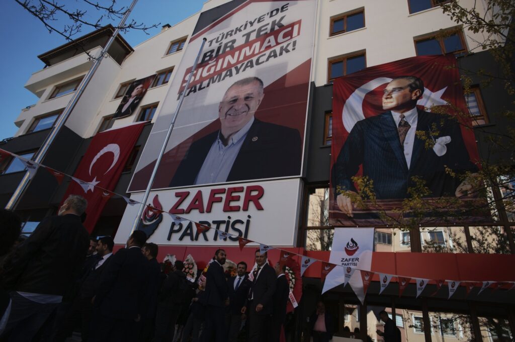 A banner reading "Not a single asylum-seeker will remain in Türkiye!" displayed at the headquarters of the anti-refugee Victory Party, above the photo of party's chair Ümit Özdağ, in the capital Ankara, Türkiye, November 6, 2021. (AP Photo)