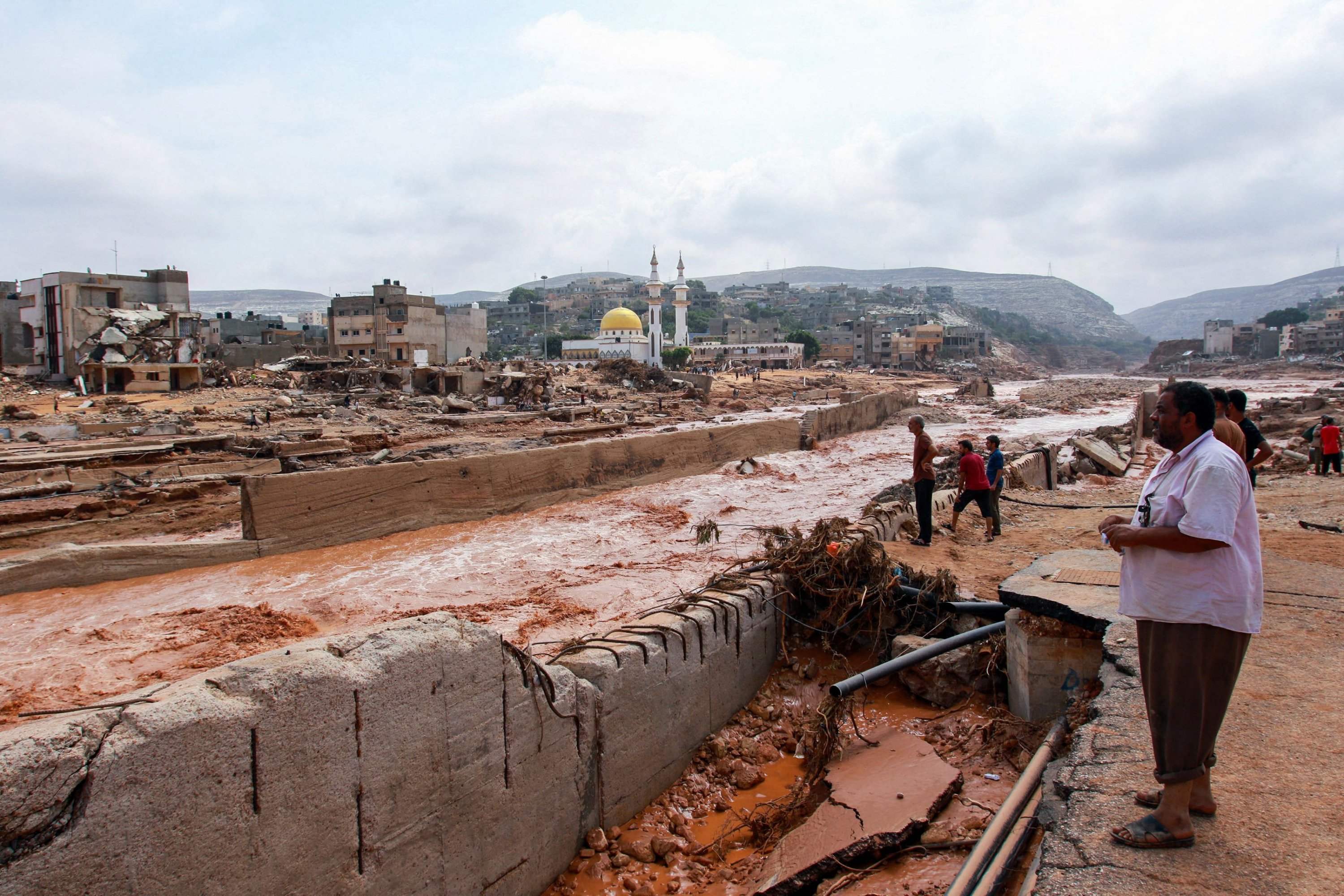 291802 People look at the damage caused by freak floods in Derna, eastern Libya, Sept. 12, 2023. (AFP Photo)