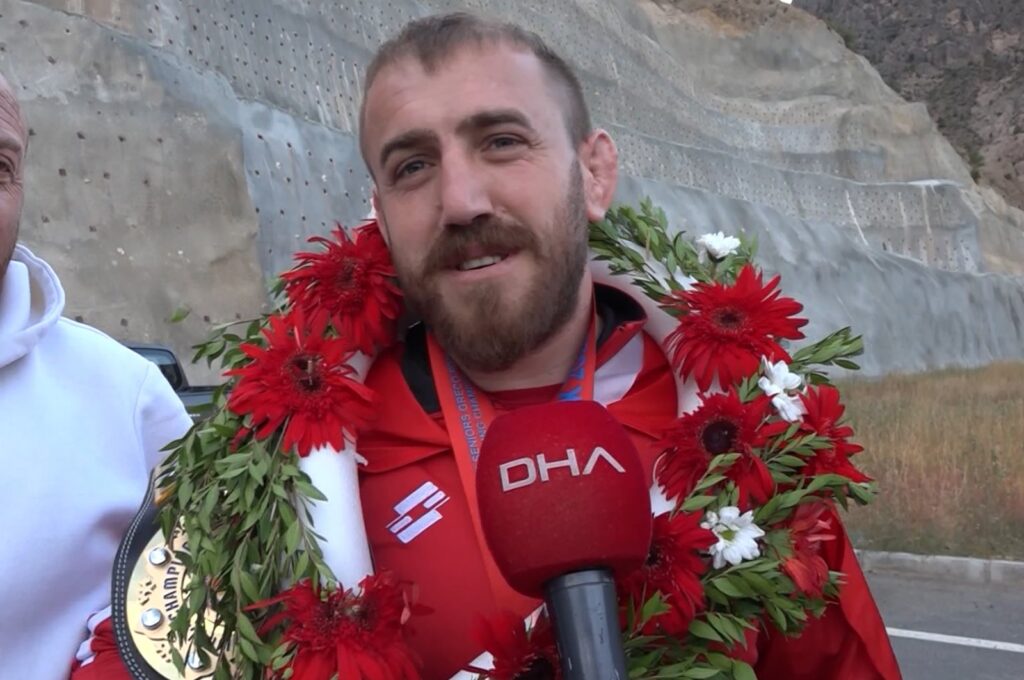 Mehmet Tüylü speaks to the press after returning from the 7th Deaf Wrestling World Championship, Artvin, Türkiye, Sept. 12, 2023. (DHA Photo)