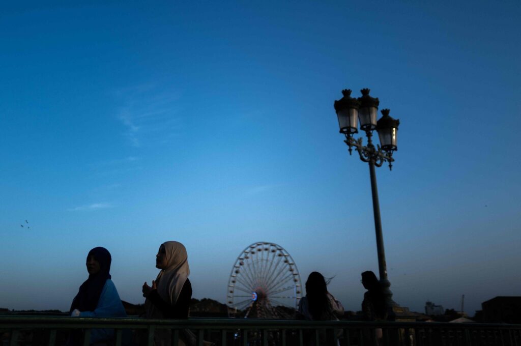Women wearing an "abaya" walk on a bridge in the southwestern city of Toulouse, France, Sept. 6, 2023. (AFP Photo)