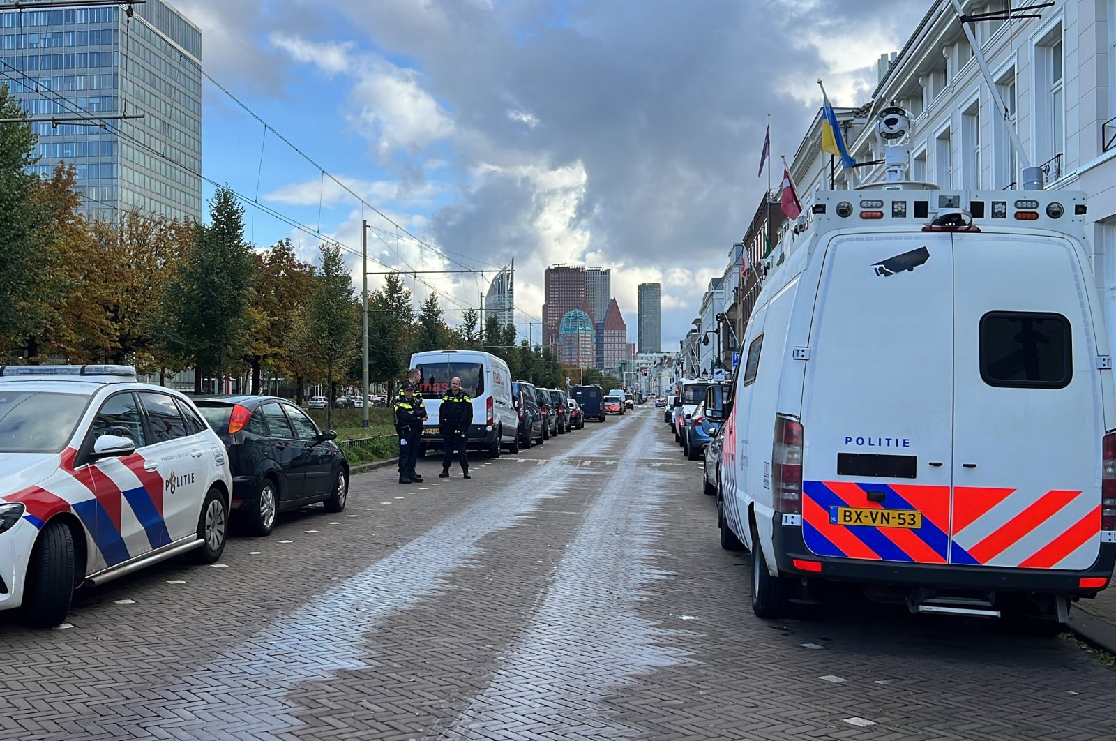 The anti-Muslim group PEGIDA desecrated a copy of the Quran in front of the Turkish Embassy in The Hague while police teams waited nearby, Netherlands, Sept. 23, 2023 (AA Photo)