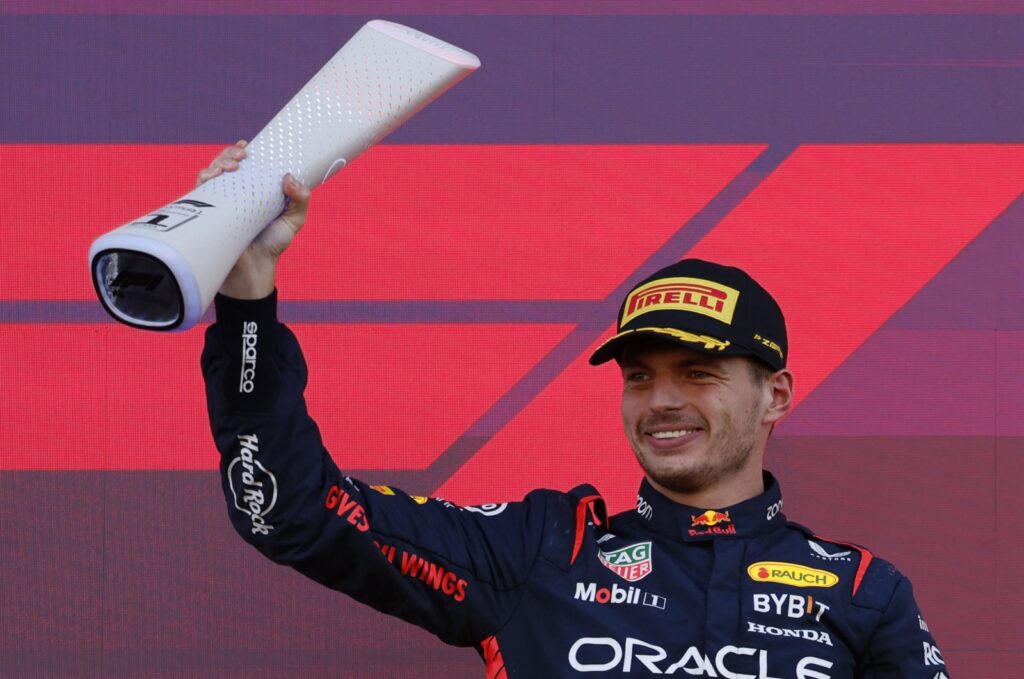 Red Bull's Max Verstappen celebrates with a trophy on the podium after winning the F1 Japanese Grand Prix, Suzuka, Japan, Sept. 24, 2023. (Reuters Photo)