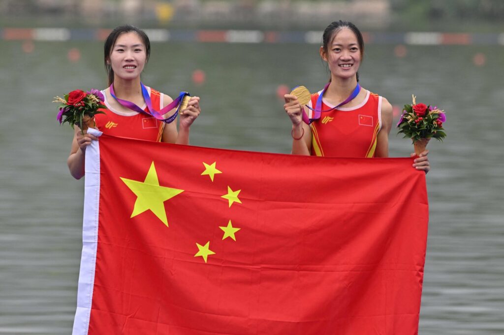 Gold medallists China's Zou Jiaqi and Qiu Xiuping pose for a photo after the women's light-weight double sculls final during the 2022 Asian Games, Hangzhou, China, Sept. 24, 2023. (AFP Photo)