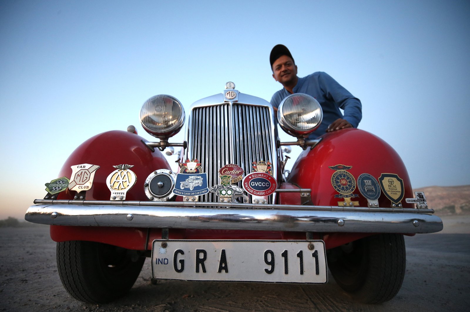 Indian businessperson Daman Thakore poses with his 1950 model classic car called "Lal Pari," Cappadocia, Türkiye, Sept. 26, 2023. (AA Photo)