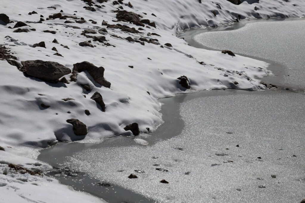 Melting ice of a small pool of the Schneeferner Glacier below Germany's highest mountain Zugspitze, near Garmisch-Partenkirchen, Germany, Sept. 26, 2023. (EPA Photo)