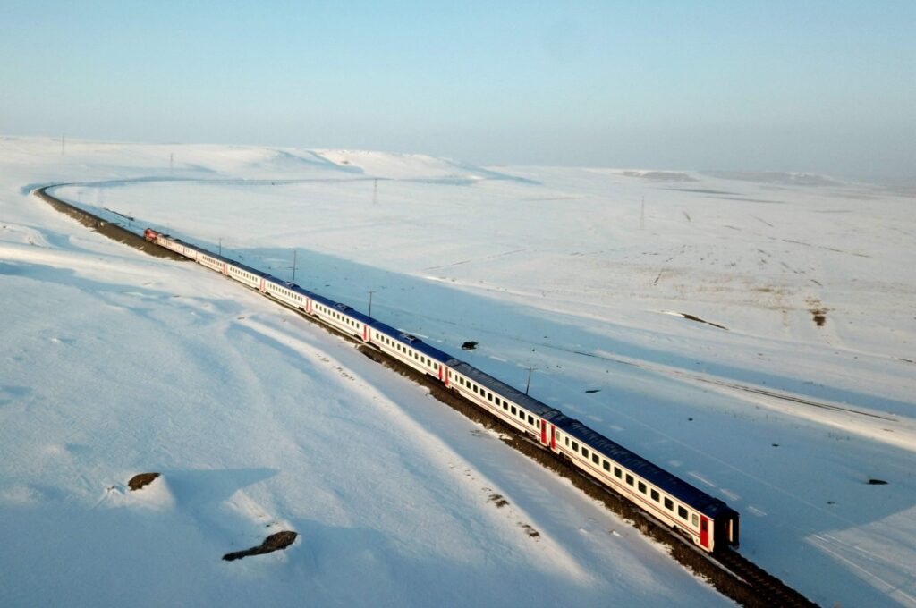 An aerial view of the Eastern Express train passing through a snowy field near Kars, Türkiye, Jan. 9, 2022. (AFP Photo)
