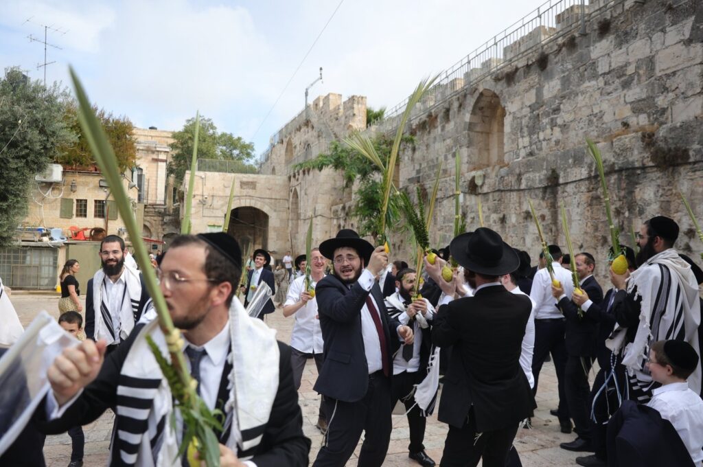 Orthodox Jews pray at the Lions' Gate, the entrance to the Temple Mount complex and Al Aqsa Mosque, occupied East Jerusalem, Palestine, Oct. 1, 2023. (EPA Photo)