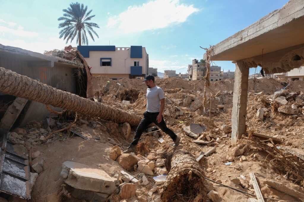 A man walks on the rubble of his flood-destroyed house in Derna, Libya, Sept. 28, 2023. (Reuters Photo)