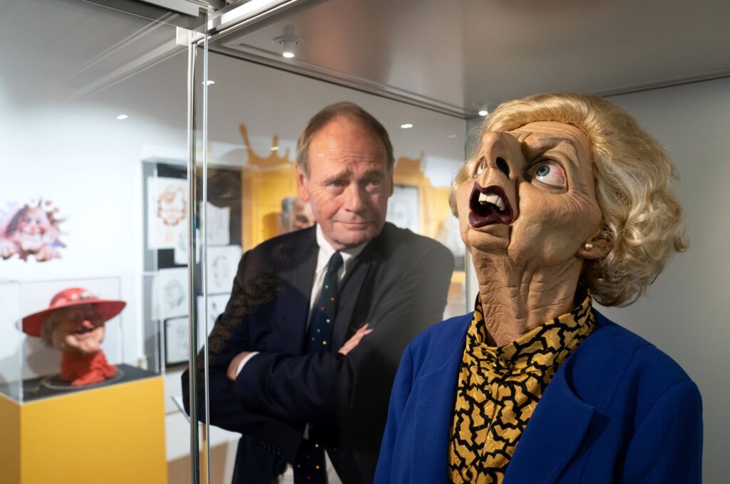 Spitting Image producer John Lloyd with a puppet of former Prime Minister Margaret Thatcher during the preview for the Spitting Image exhibition at Cambridge University Library, London, U.K., Sept. 28, 2023. (dpa Photo)