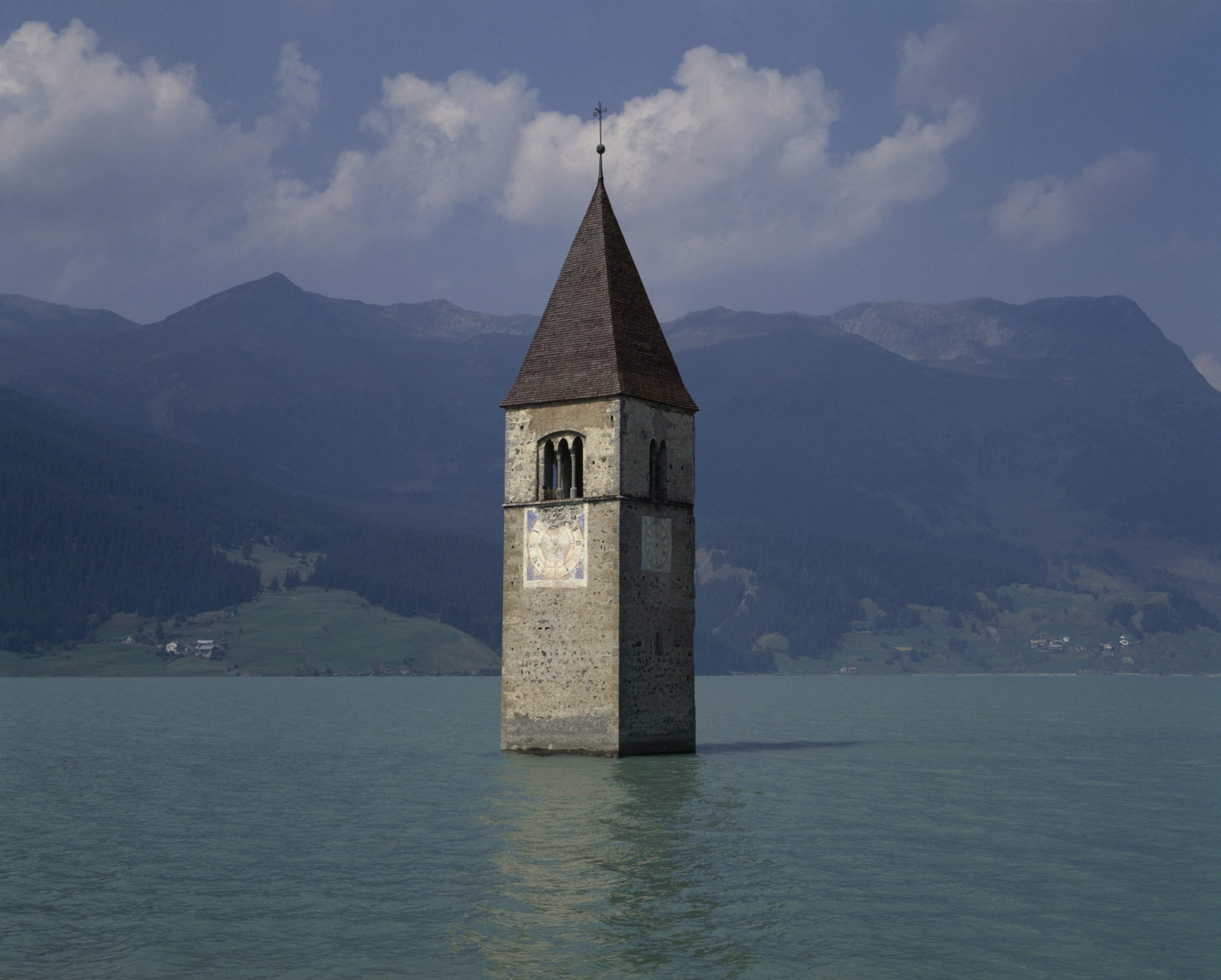 295250 The top of the half-submerged bell tower in Curon (Graun), 1357, emerging from the waters of Reschense, Curon Venosta, Italy, Feb. 2, 2017. (Getty Images Photo)