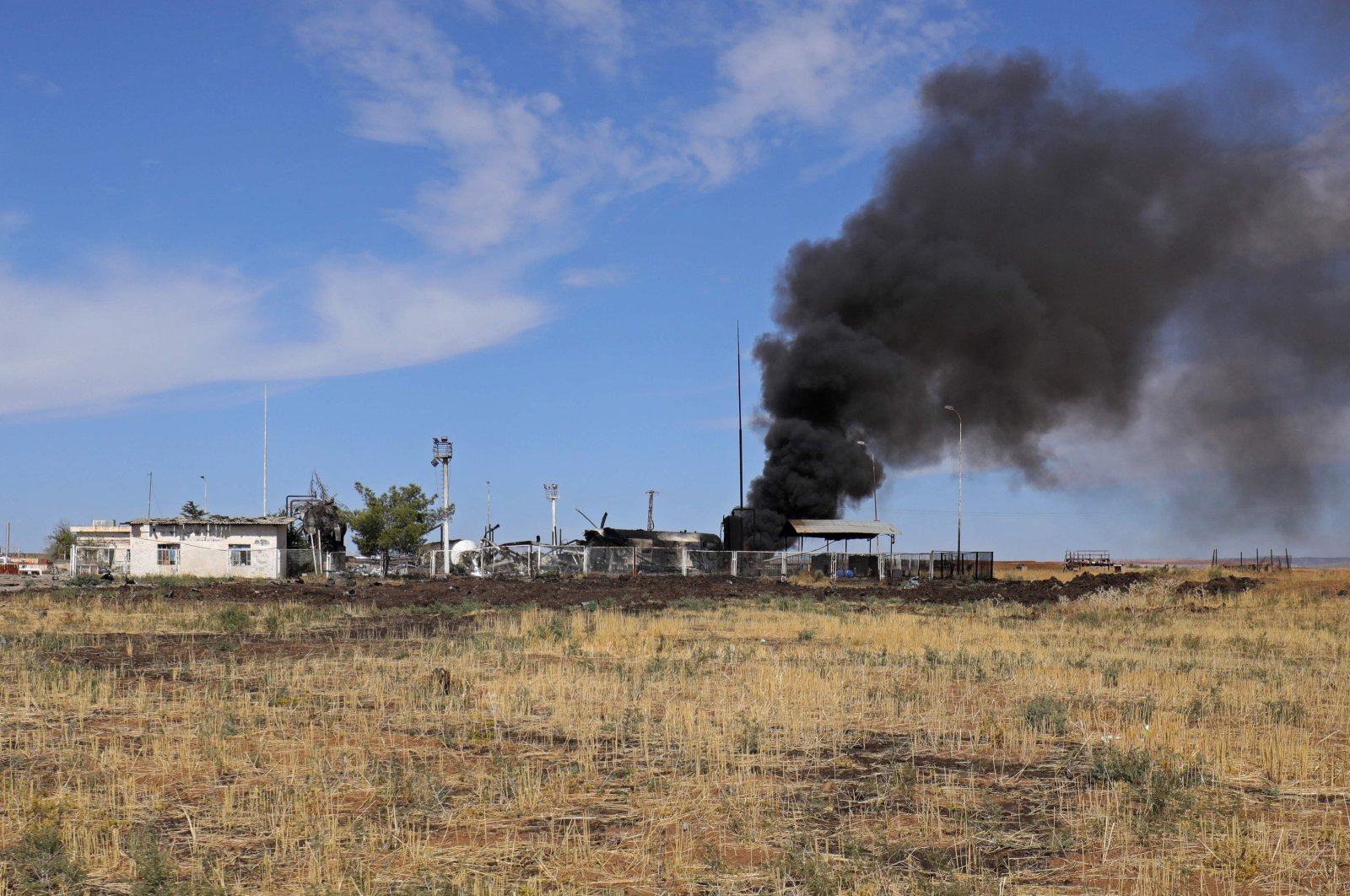 Smoke billows from the Basbasi oily facility following a Turkish strike in the countryside of al-Qahtaniya in Syria's PKK/YPG-controlled northeastern Hassakeh province, Syria, Oct. 6, 2023. (AFP Photo)