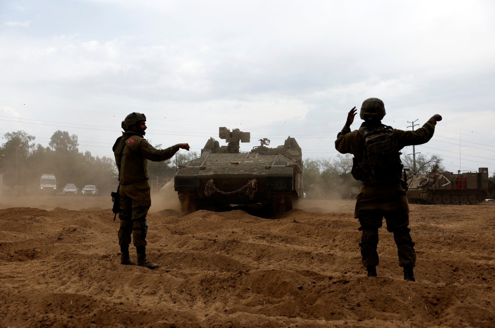 Israeli soldiers direct an Armoured Personnel Carrier (APC) at the Israeli side of the Gaza border, Oct. 9, 2023. (Reuters Photo)