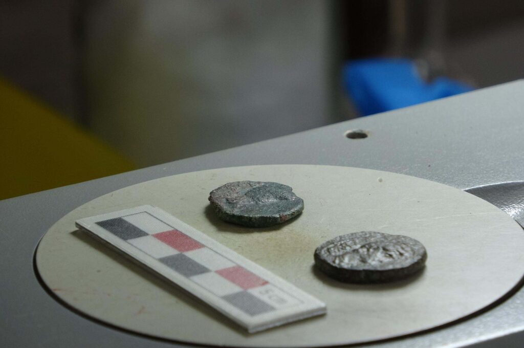 Two 2,000-year-old bronze coins found during excavations in the ancient city of Alexandria Troas, Çanakkale, Türkiye, Oct. 9, 2023. (DHA Photo)