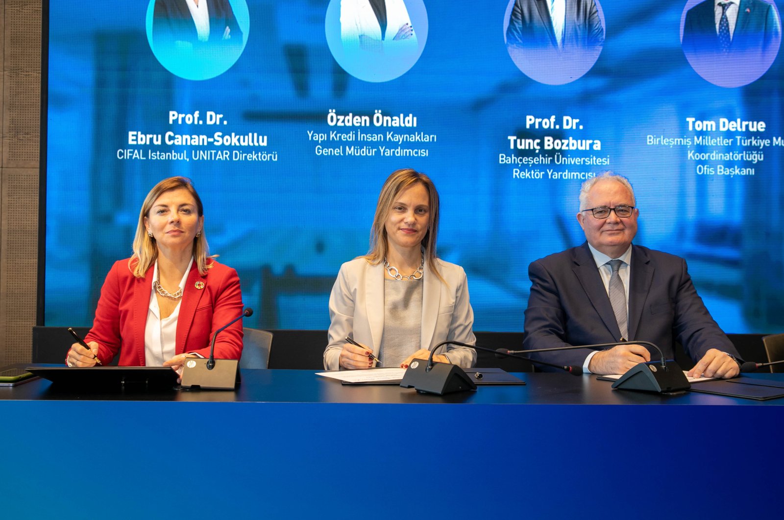 Ebru Canan-Sokullu, director of CIFAL Istanbul-UNITAR, Özden Önaldı, Yapı Kredi deputy general manager, and Tunç Bozbura, vice-rector of Bahçeşehir University, are seen during the conference presenting the project, titled "Equal Opportunity in Technology," Istanbul, Türkiye, Nov. 21, 2023. (Courtesy of Yapı Kredi Bank)