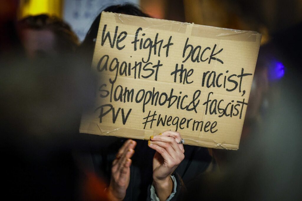 A supporter of the anti-fascist Action (Antifa) holds a placard during a protest rally at the city hall in Utrecht, Netherlands, Nov. 23, 2023. (EPA Photo)
