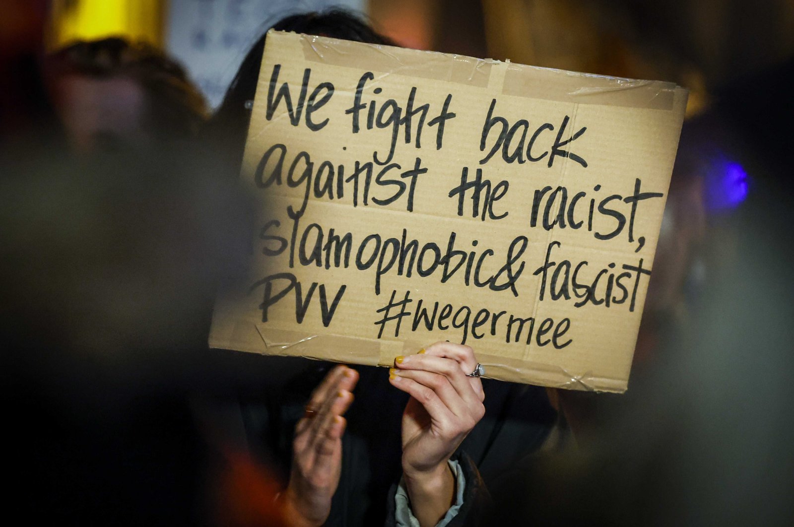 A supporter of the anti-fascist Action (Antifa) holds a placard during a protest rally at the city hall in Utrecht, Netherlands, Nov. 23, 2023. (EPA Photo)