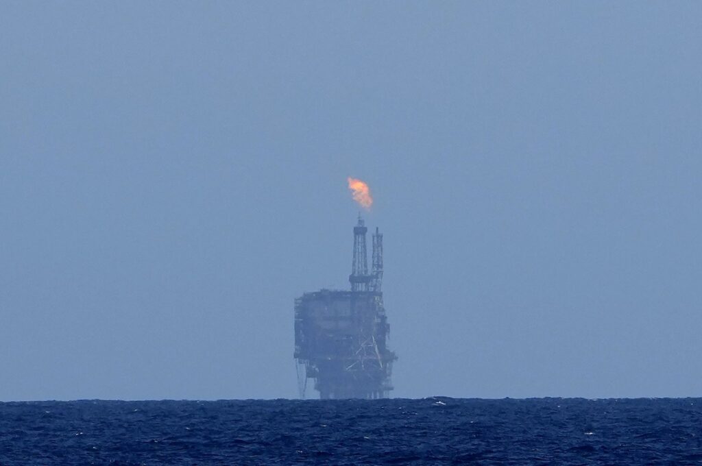 An oil platform is visible on the horizon in international waters near Libya, Mediterranean Sea, Sept.17, 2022. (AP Photo)
