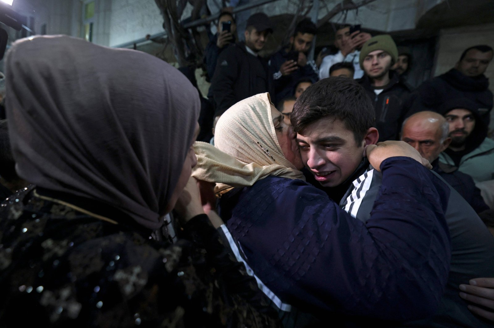 Palestinian prisoner Khalil Zama' (R) hugs a relative after being released from an Israeli jail, Hebron, occupied West Bank, Nov. 27, 2023.