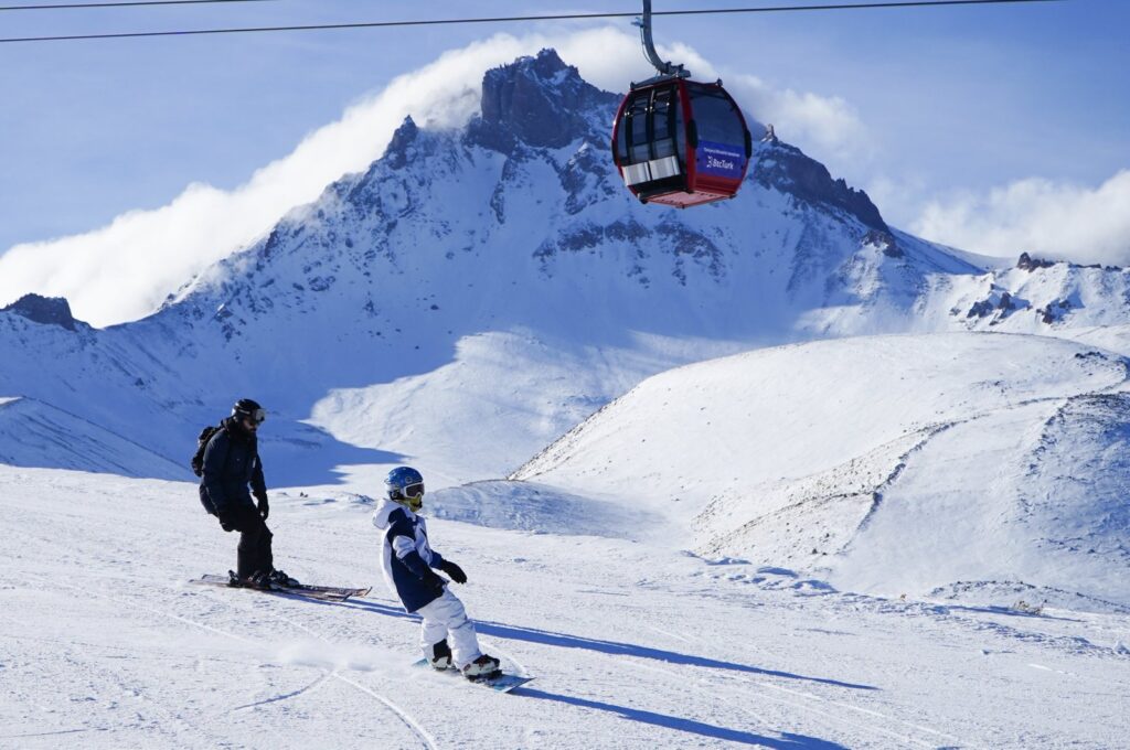 A group of people is seen skiing on the slopes of Erciyes Mountain at Erciyes Ski Center, Kayseri, central Türkiye, Nov. 26, 2023. (AA Photo)