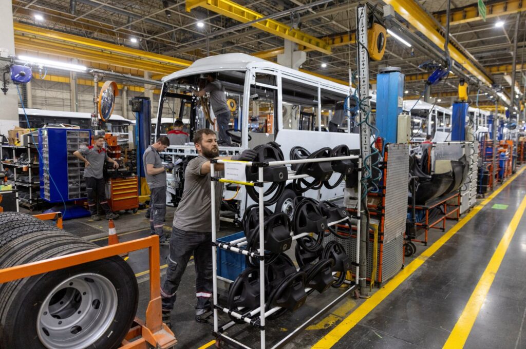 Technicians work on a bus at a production line of Türkiye's heavy commercial and armored vehicle manufacturer Otokar factory in Arifiye, a town in Sakarya province, Türkiye, July 13, 2023. (Reuters Photo)