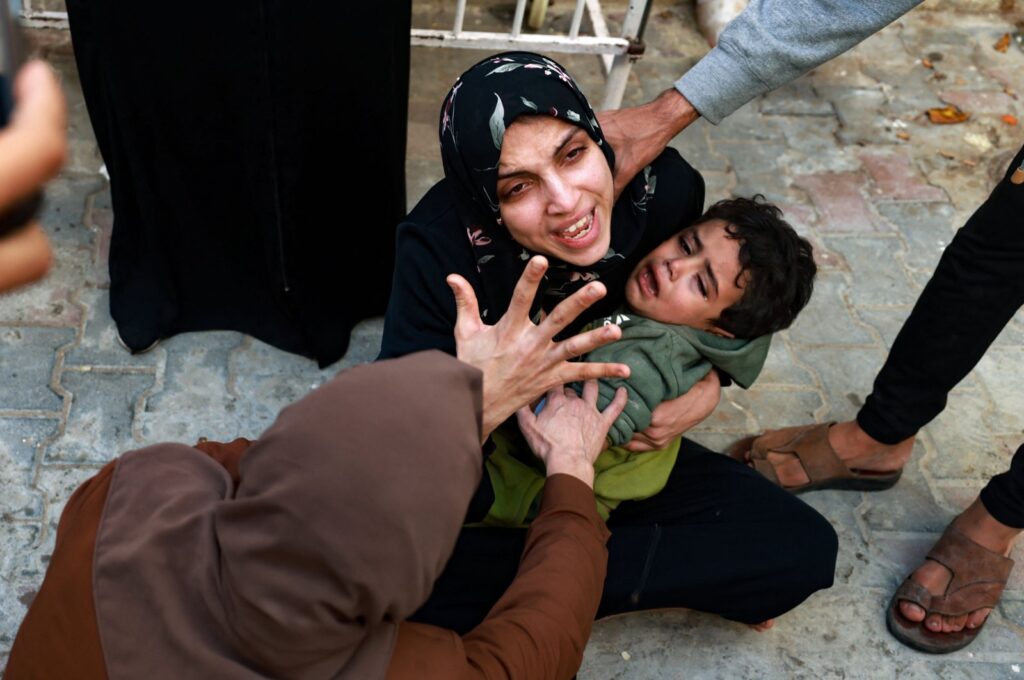 A woman holding a child mourns her baby girl killed in an Israeli airstrike in Rafah, southern Gaza Strip, Palestine, Dec. 1, 2023. (AFP Photo)