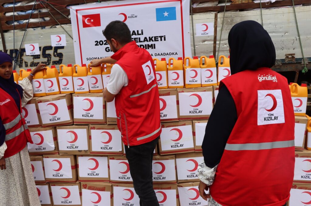 Turkish Red Crescent volunteers are photographed next to the stand with some of 2,000 packages for the flood-hit citizens of Somalia, Dec. 2, 2023. (AA Photo)