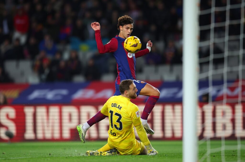 Barcelona's Joao Felix scores past Atletico Madrid's Jan Oblak during the La Liga match at Estadi Olimpic Lluis Companys, Barcelona, Spain, Dec. 3, 2023. (Getty Images Photo)