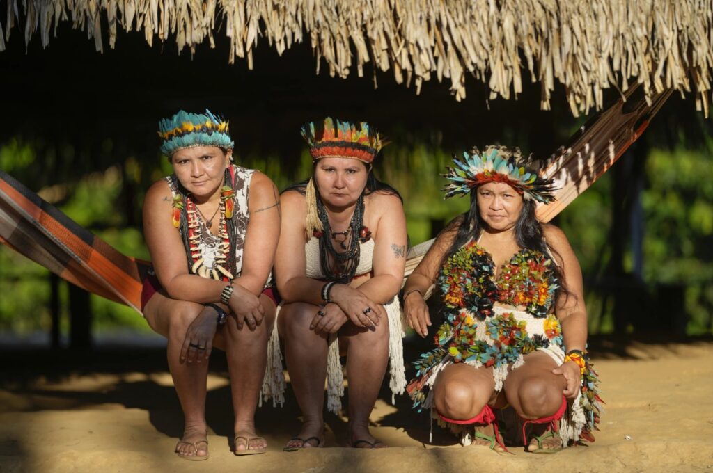 Juma Indigenous sisters Mandei Juma, from left, Mayta Juma and Borea Juma at their community, near Canutama, Amazonas state, Brazil, July 9, 2023. (AP Photo)