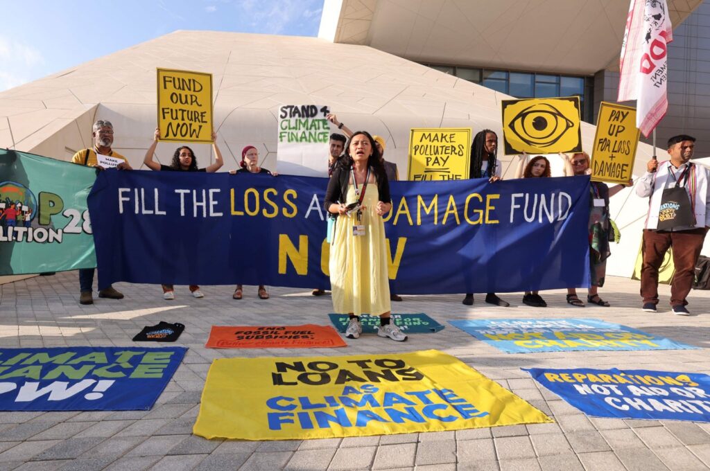 Activists participate in a demonstration for the "Loss and Damage" fund at the U.N. climate summit COP28 in Dubai, United Arab Emirates, Dec. 4, 2023. (AFP Photo)