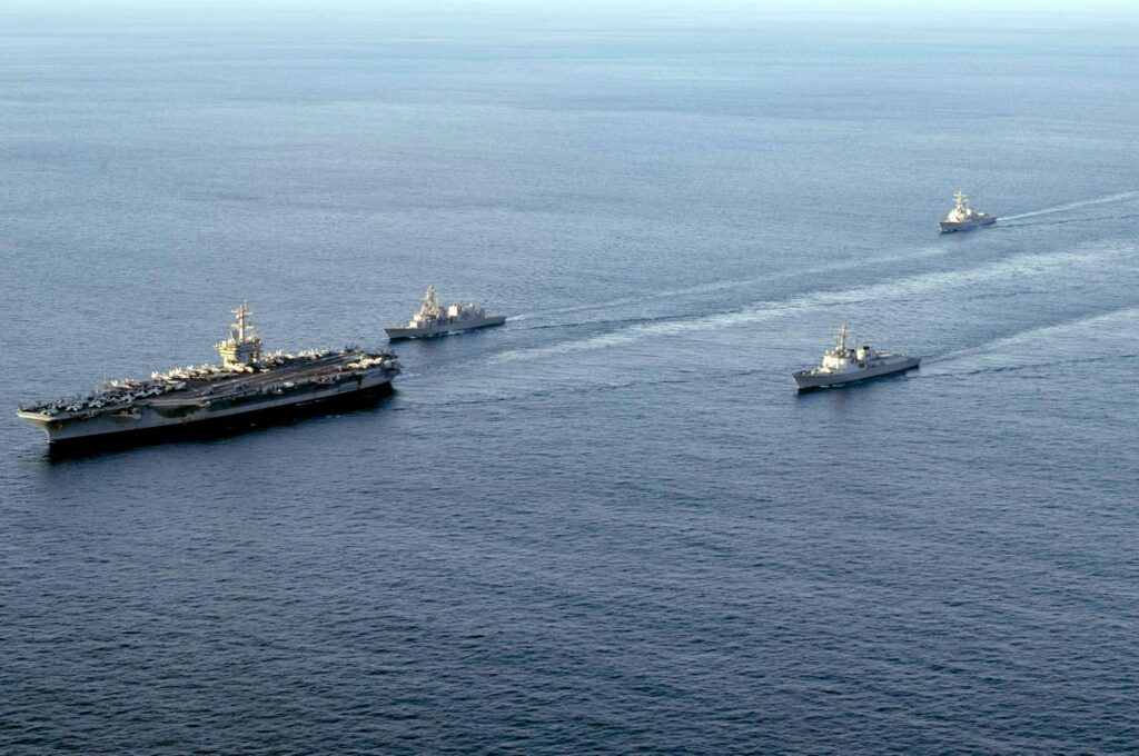 A handout photo made available by the U.S. Navy shows (L-R) the nuclear-powered aircraft carrier USS Carl Vinson, the Japan Maritime Self-Defense Force's destroyer Kirisame, South Korea's Aegis-equipped destroyer Sejong the Great, and the guided-missile destroyer USS Kidd sailing in southeastern waters off Jeju Island, South Korea, Nov. 26, 2023. (EPA Photo)