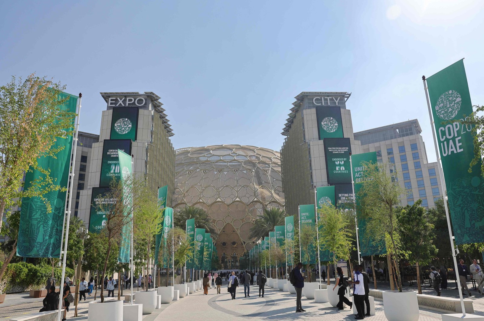 People walk at the venue of the COP28 United Nations climate summit in Dubai, United Arab Emirates, Dec. 6, 2023. (AFP Photo)