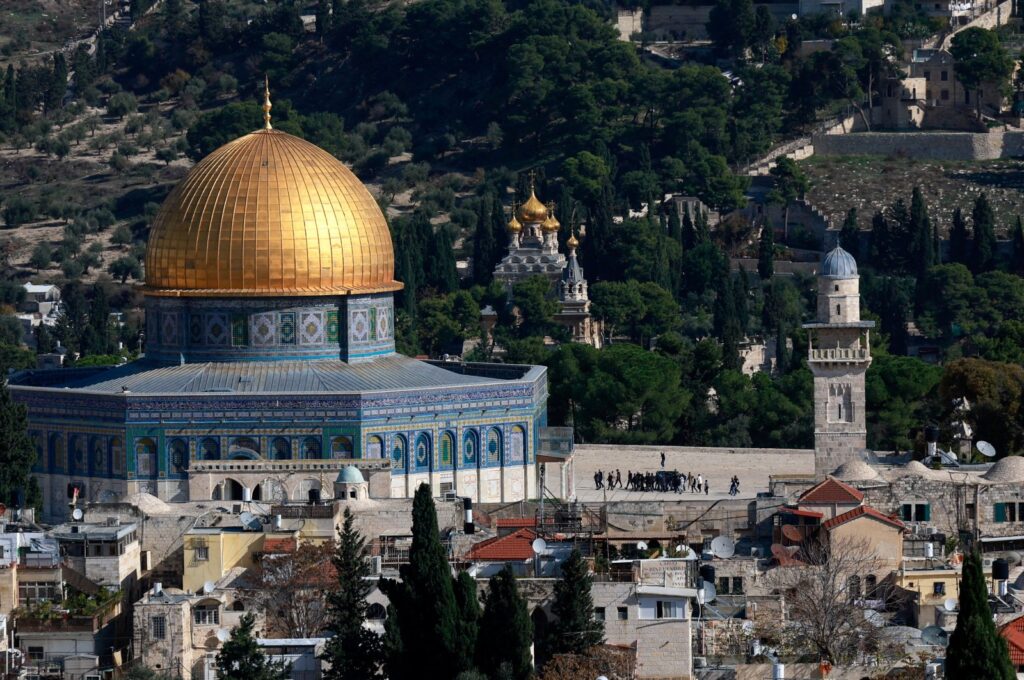 People walk near The Dome of the Rock in the Al-Aqsa compound in Jerusalem's Old City, Palestine, Dec. 4, 2023. (Reuters Photo)