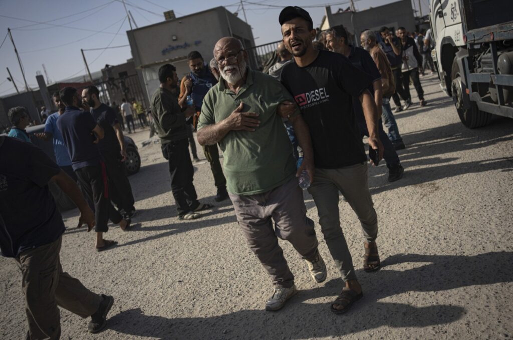 Palestinian day laborers in Israel arrive in the Gaza Strip at the Kerem Shalom crossing, Nov. 3, 2023. (AP Photo)