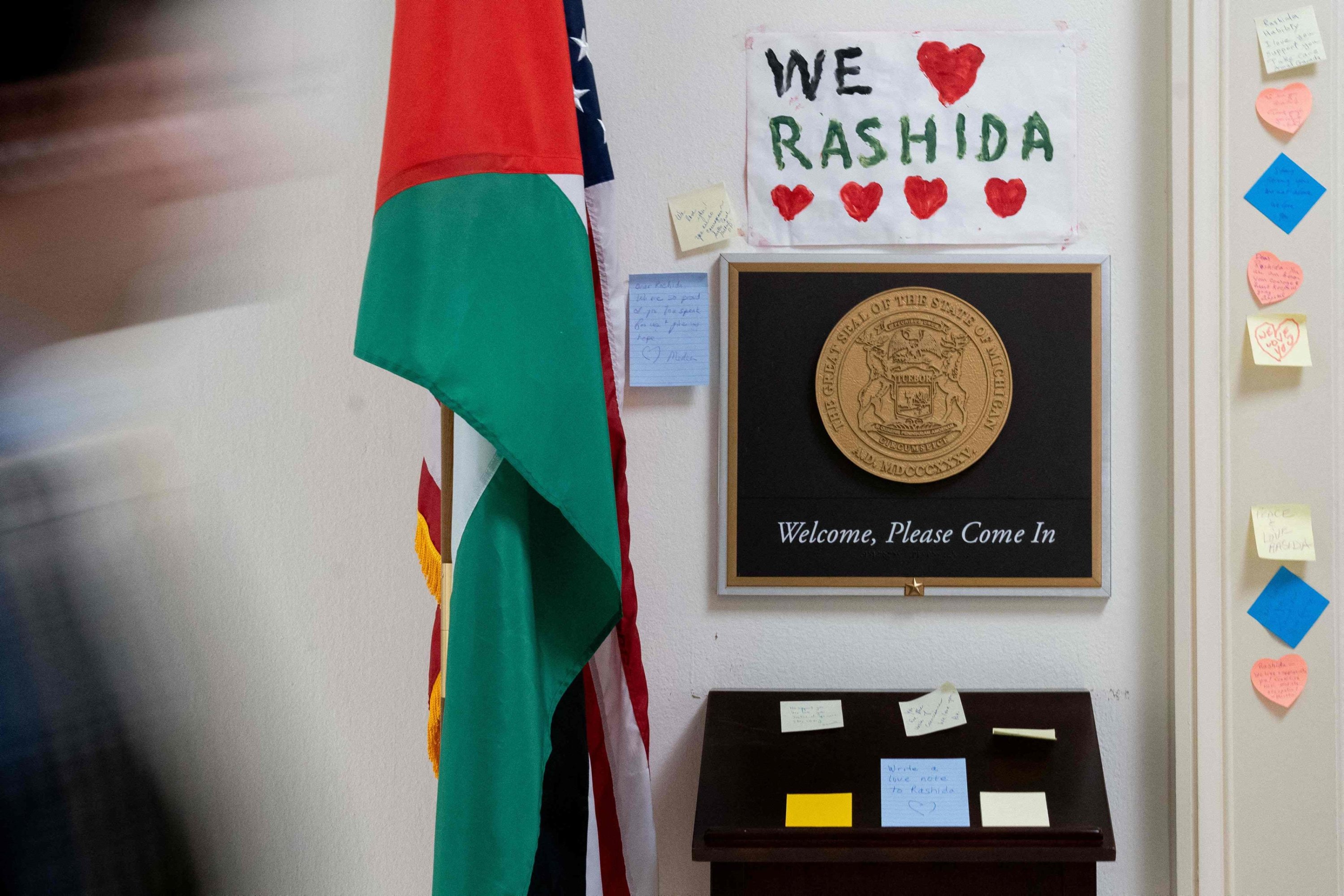 304607 A person walks past signs and notes left outside the office of U.S. Rep. Rashida Tlaib, Democrat of Michigan, on Capitol Hill in Washington, D.C., Nov. 8, 2023. (AFP Photo)