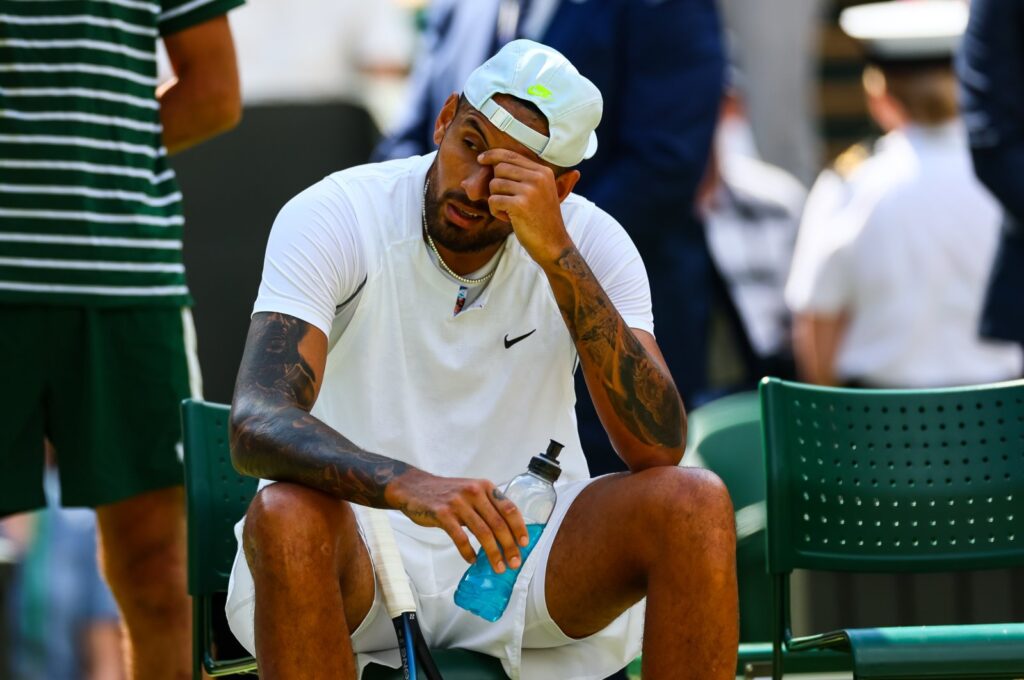 Australia's Nick Kyrgios looks in pain with a shoulder injury during his match against Brandon Nakashama of the United States during day eight of The Championships Wimbledon 2022 at All England Lawn Tennis and Croquet Club, London, UK., July 4, 2022. (Getty Images Photo)