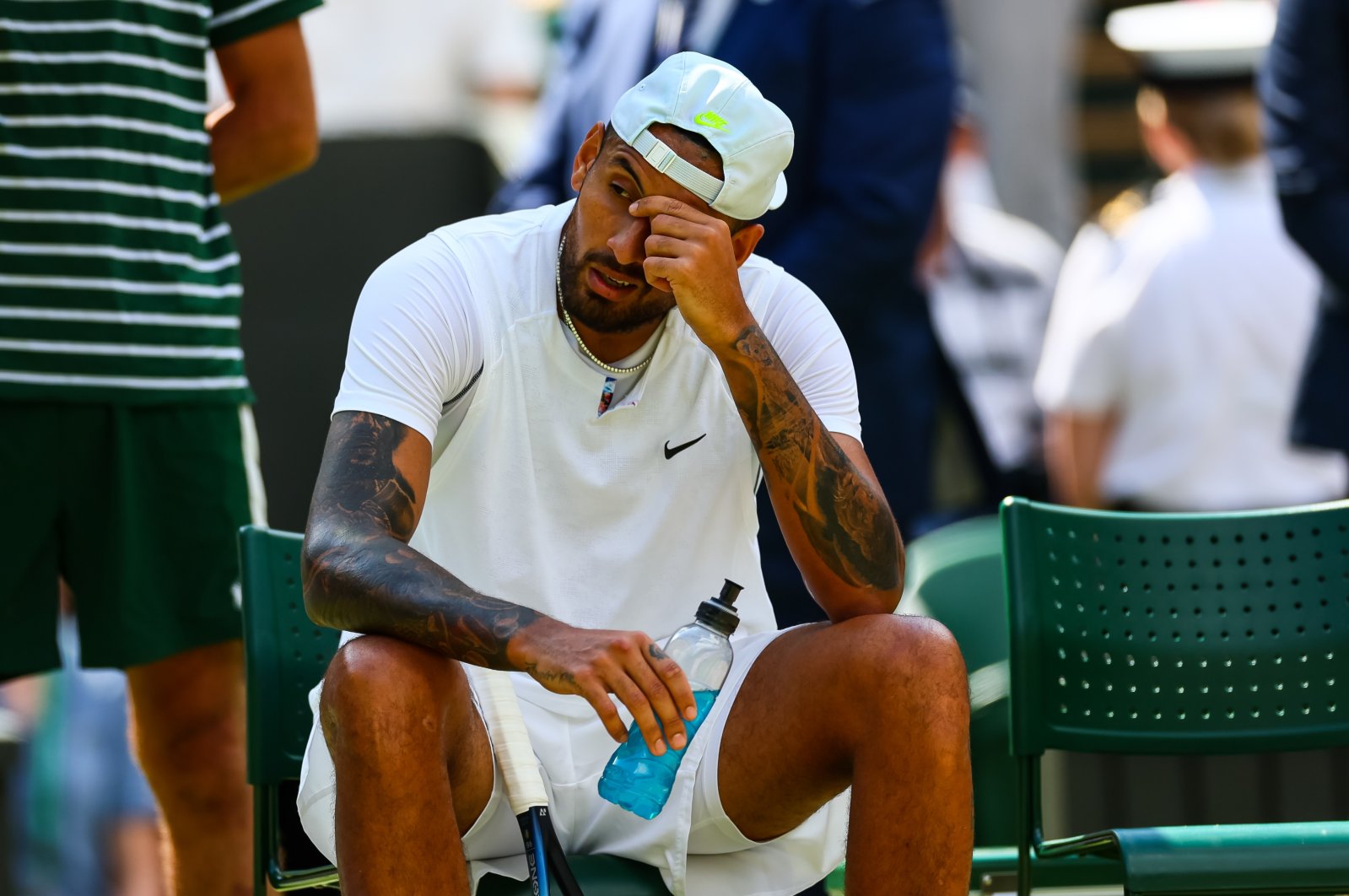 Australia's Nick Kyrgios looks in pain with a shoulder injury during his match against Brandon Nakashama of the United States during day eight of The Championships Wimbledon 2022 at All England Lawn Tennis and Croquet Club, London, UK., July 4, 2022. (Getty Images Photo)