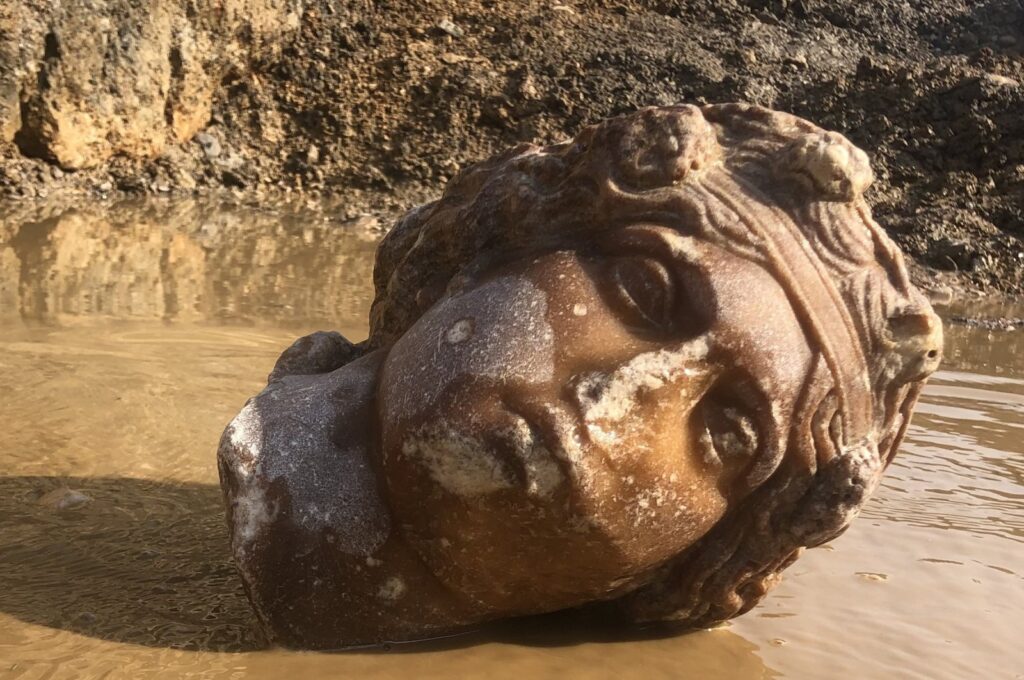 The excavation work carried out at the ancient city of Aizanoi in the Çavdarhisar district of Kütahya revealed the second statue head of Aphrodite, known as the goddess of love and beauty in mythology, and the third statue head of the wine god Dionysus, Kütahya, western Türkiye, Dec. 8, 2023. (AA Photo)