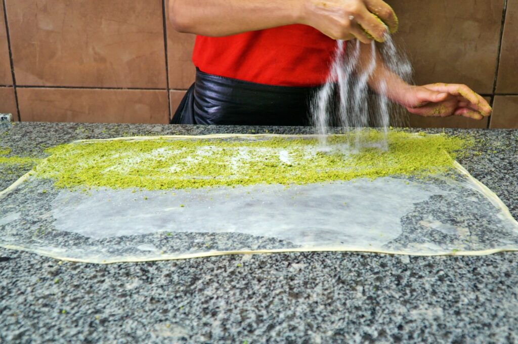 Making traditional crisp flaky pastry (katmer in Turkish) famous for Gaziantep, Türkiye. (Getty Images Photo)