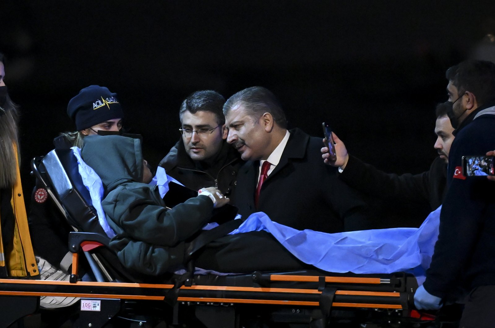 Health Minister Fahrettin Koca talks to an evacuated patient, in the capital Ankara, Türkiye, Dec. 12, 2023. (AA Photo)