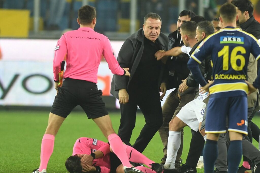 Turkish referee Halil Umut Meler is knocked to the ground after a punch by Ankaragücü's President Faruk Koca (3rd L) after the Turkish Süper Lig match between Ankaragücü and Rizespor, Ankara, Türkiye, Dec. 11, 2023. (EPA Photo)